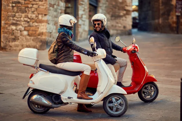 woman and man on scooters 